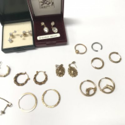 A collection of 9ct gold and yellow metal earrings. Postage B