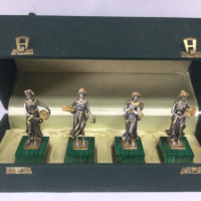 A cased set of four silver gilt figures depicting the four seasons, marked 800. Approx height 8.5cm. Shipping category B.