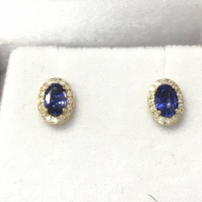 A pair of 9ct gold oval sapphire and diamond cluster studs. Sapphires 0.76ct and diamonds 0.12ct. Postage B
