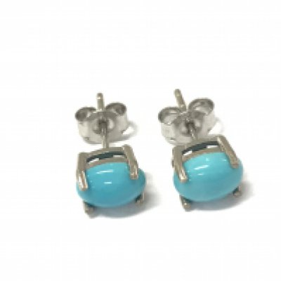 A pair of oval cabochon turquoise studs in silver. Postage A