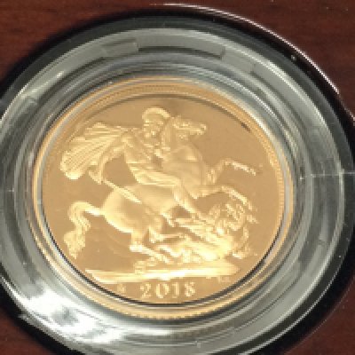 A 2018 gold proof sovereign with COA and box.Postage B