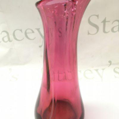 A cranberry heavy art glass vase , 28cm tall. This lot cannot be posted