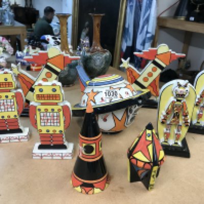 Nine pieces of Lorna Bailey pottery to include limited edition 234/350 Tea pot decorated with Stars and Stripes, four flat-backs of Robots, Moonraker pattern sugar shaker and one other limited edition 298/350 sugar shaker