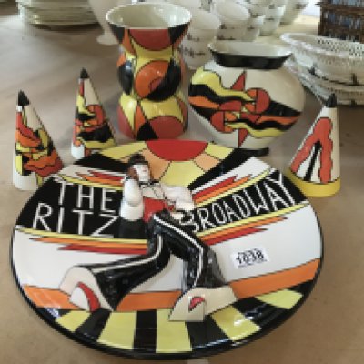 Six Lorna Bailey pottery pieces including "Ritz The Broadway"- Deco Lady charger Ginger (limited edition 50/100 , with certificate of authenticity), together with sugar shakers in the Mirage colour way and two vases