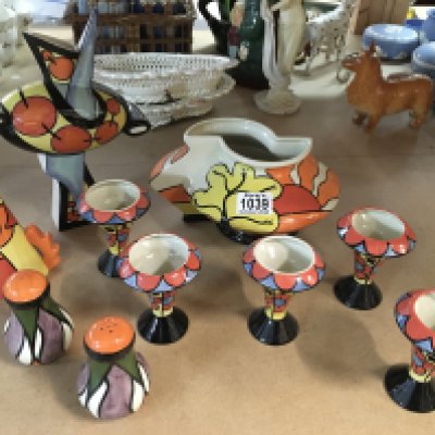 A collection of Lorna Bailey items including "Oaklands" geometric shaped vase, bud vases, salt and pepper pot, decorative vase and 3rd limited edition Sunset sugar shaker