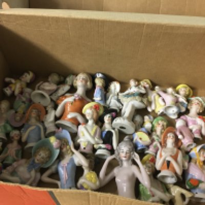 A Collection of pin dolls.
