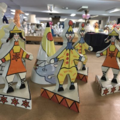Six Lorna Bailey pieces, to include Artic pattern vase and sugar shaker and four limited edition circus figure flat-backs