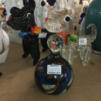 A pair of Murano glassware dogs and a mdina paper weight