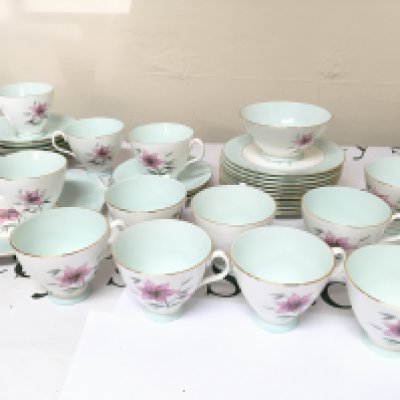 A Quality Royal Albert Bone China twelve place setting British tea set The Elfin pattern cups saucers side plates serving plate sugar bowl and cream jug. No Obvious Damage very good condition.