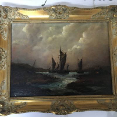 A Gilt framed oil painting on canvas Coastal scene with moored sailing vessels. Signed lower right. 52cmx51cm