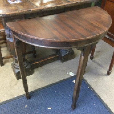 A small mahogany demi lune hall table. Shipping category D.- NO RESERVE