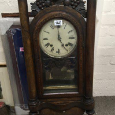A late Victorian walnut cased wall clock with ornamental pillars and applied carving Height 98cm- NO RESERVE