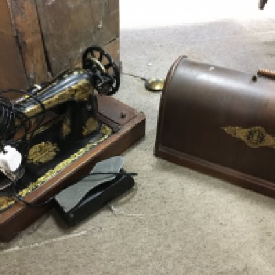 A cased Singer sewing machine and a letter rack. This lot cannot be posted- NO RESERVE