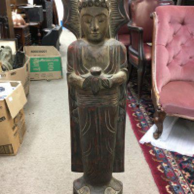 A wooden carved standing buddha. Approx 102cm tall.