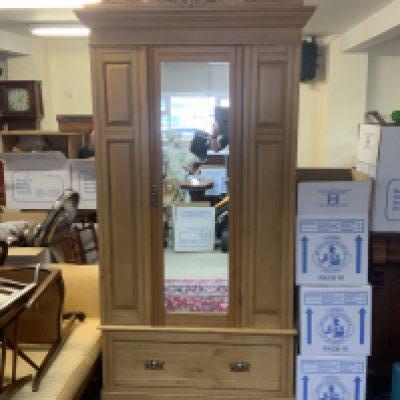 An Edwardian mirror fronted satinwood wardrobe with single draw to base. 212cm x 107cm x 49cm