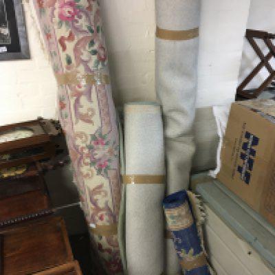 Four Chinese floral patterned rugs including large examples in green and light pink colours and one small blue rug