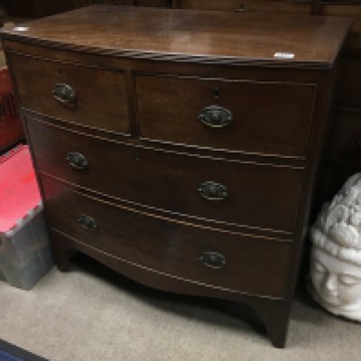 A Victorian mahogany bow fronted chest of drawers, fitted with two short and two long drawers