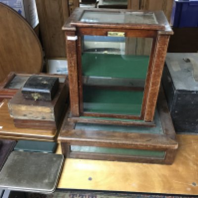 A table top cabinet together with empty cutlery cases and a small glazed cabinet with single shelf