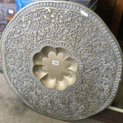 An Indian brass tray. 75cm across