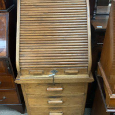 A 1930s Lebus Oak Tambour fronted desk. 117cm x 63cm x 58cm