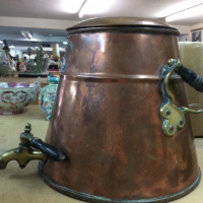 A large heavy two handled vessel with tap . This lot cannot be posted