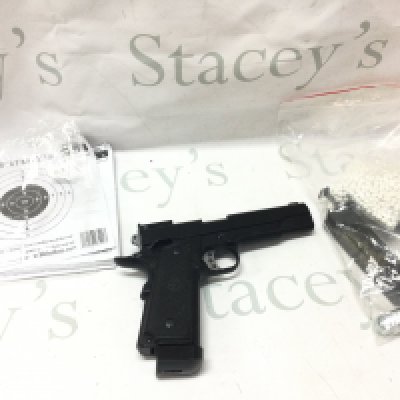 A WE 1911 Airsoft pistol with BBs, Loader, gun oil etc . Postage category B
