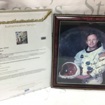 A signed photograph of Neil Armstrong with Certificate of authenticity . Postage category C