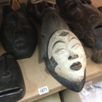 A collection of six African tribal masks including Republic of Congo and Chokwe .