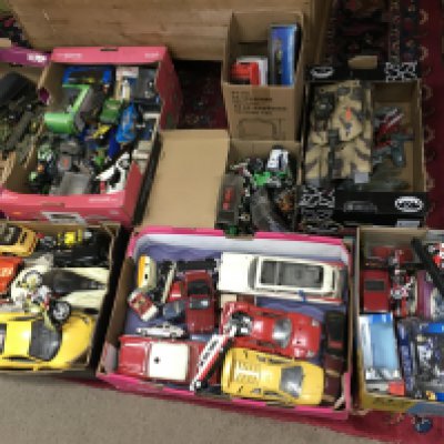 A large collection of toy cars ,bikes ,Dinky army vehicles , large hulk hogan figure etc. this lot cannot be posted