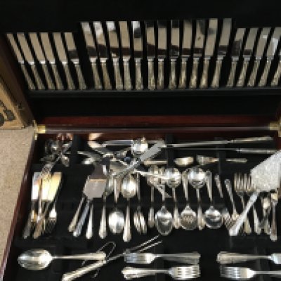 A large cased canteen of Sheffield stainless steel cutlery . This lot cannot be posted