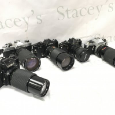 Five vintage SLR cameras including Pentax ME super with Tamron 210mm lens, Codina CT-1A with vivitar 200m lens, Fujica STX-1 , Minolta X-700 with Makinon 200mm lens. This lot cannot be posted