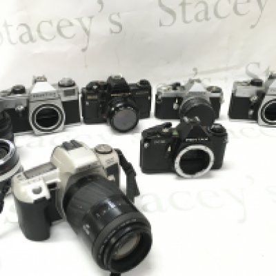 Six vintage SLR cameras including Pentax, Minolta etc. postage cat c