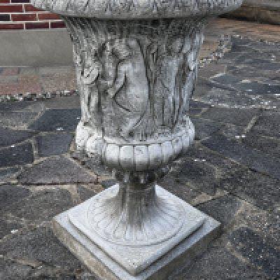 A large cast concrete planter of classical design (Sold in situ).