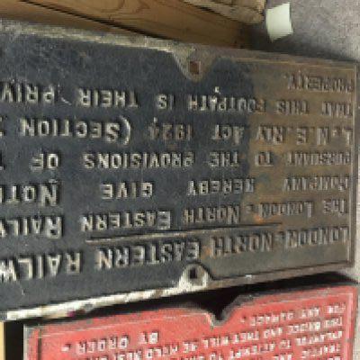 A cast iron railway sign London north eastern footpath notice .