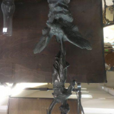 A spelter figure in the form of a classic figure in the style of Ernest Barrias together with a a spelter single mast gallon.