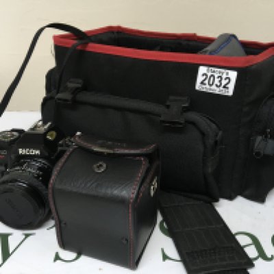 A Ricoh KR-10 35mm camera and Sigma lens a flash and other equipment in a camera canvas case.