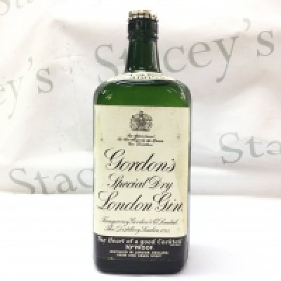 A vintage bottle of Gordons Gin. This lot cannot be posted