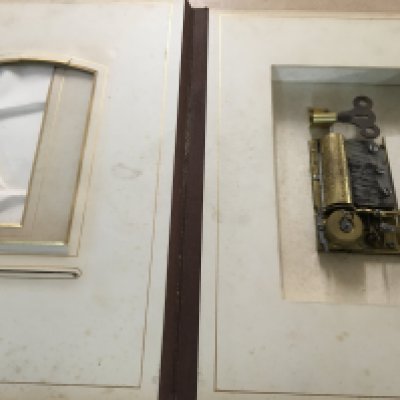 A Victorian photo Album inset with a music box .- NO RESERVE