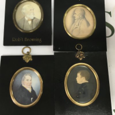 Four framed ebonised portrait miniatures to include Robert Browning, a Georgian gentleman and a young boy
