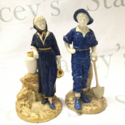 A pair of Royal Worcester porcelain powder blue glazed James Hadley Farmer couple figures , dated 1810.
