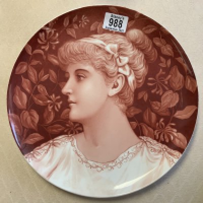 A ceramic wall charger with a hand painted pre-Raphaelite design of a lady. Impressed W to reverse. 30cm- NO RESERVE