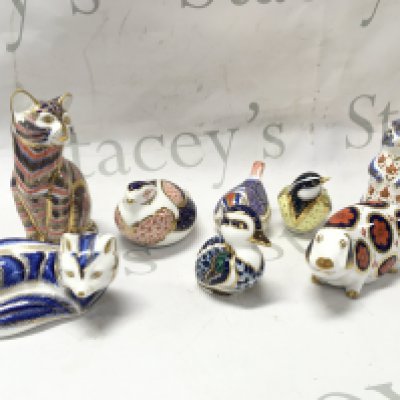 A collection of Royal Crown Derby porcelain paperweights , some with gold stoppers. This lot cannot be posted