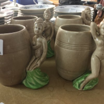 A set four Dorothy Kindell pottery mugs the handles in the form of nude maidens.