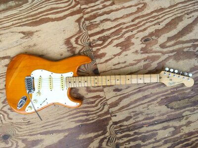 A 1993/94 USA Fender Stratocaster electric guitar. Cosmetically in good order, replacement tremolo system and tuning pegs. Comes with soft carry case.