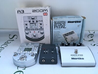 A boxed Zoom A3 acoustic remodelling pre amp and effects, a boxed Hartke AGX acoustic attack tone shaper pre amp and a Fishman G II acoustic guitar pre amp (3).