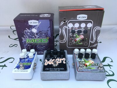 Three Electro Harmonix guitar pedals comprising a boxed Modulator, a boxed Hot Wax and The Worm (no box).