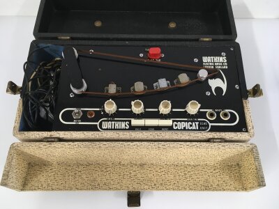 A vintage Watkins Copicat Echo unit with original cover and foot switch.