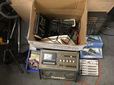 Two boxes of assorted items comprising a Behringer Eurorack, various mics, guitar strings, leads, stands etc
