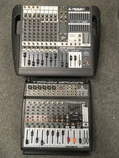 A PA system comprising a Peavey XR 886/16 input powered console, a Behringer PMP1000 powered mixer, a pair of Wharfedale Pro speakers, a pair of Mackie C300 speakers, a Torque T50 R amplifier and a Fane Collosus speaker plus some stands.
