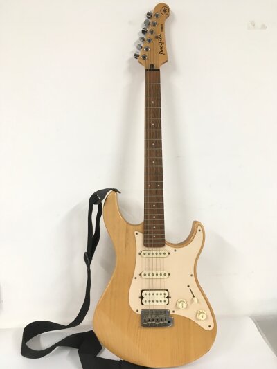 A Yamaha Pacifica electric guitar, no case.